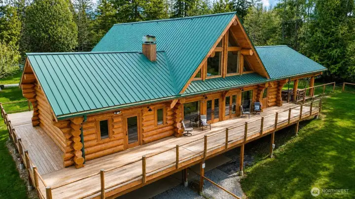 Exceptional custom estate set on 24.56 private acres, featuring timeless craftsmanship, soaring timber-frame architecture, and expansive outdoor living spaces.
