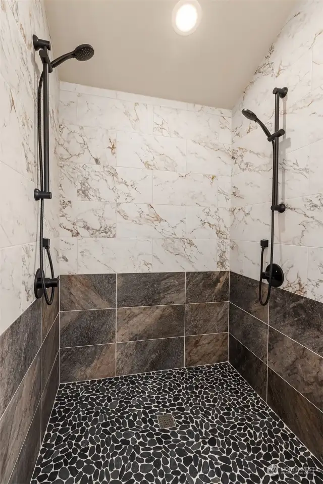 Walk in dual shower with Italian flair large format ceramic tile