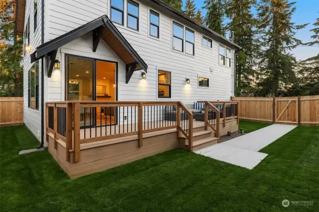 Spacious deck off the kitchen/dining area, perfect for outdoor entertaining. Features a large sliding glass door with custom "Eyebrow" cover.