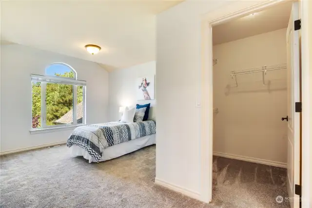 Bedroom with adjoining bathroom & walk-in closet.