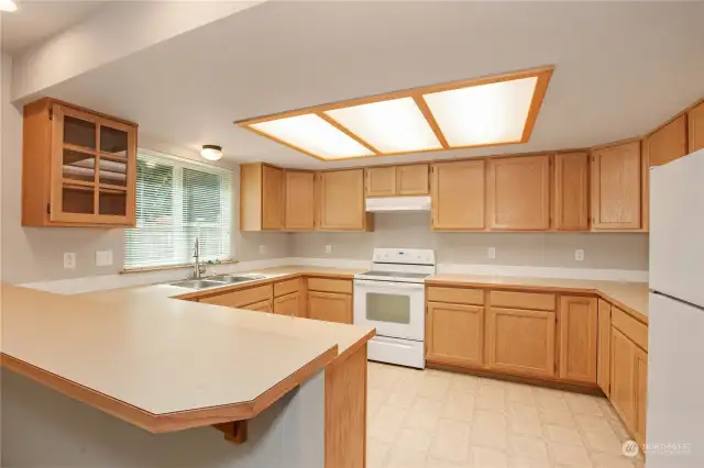 Great kitchen with tons of cupboard space and breakfast bar