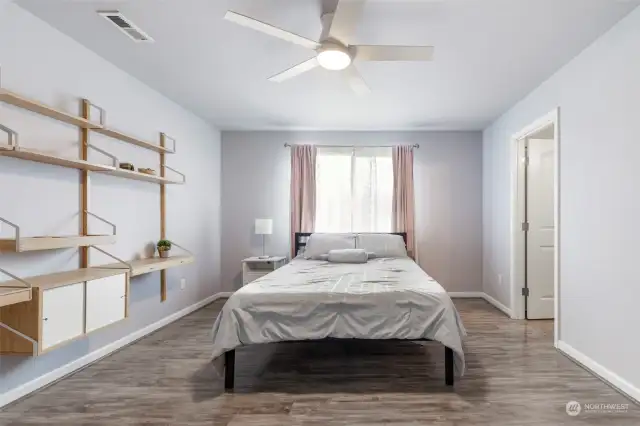 3rd level main bedroom with built in desks. Ensuite bath is off to the right. Light and bright.