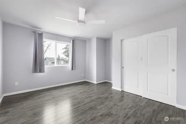 3rd level bedroom with ample closet space, a space for a desk or gaming/tv set up and ample light.