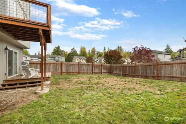 Fully fenced lower level back yard.