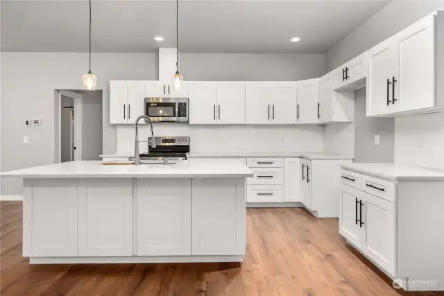 Beautiful white cabinetry and quartz countertops.