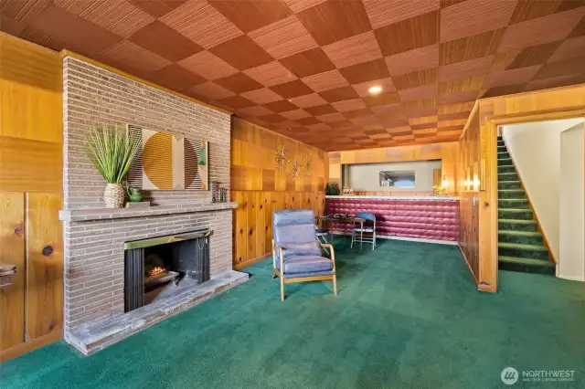 Welcome to your very own entertaining space with cozy wood fireplace.  You will be the talk of the town with that wet bar!