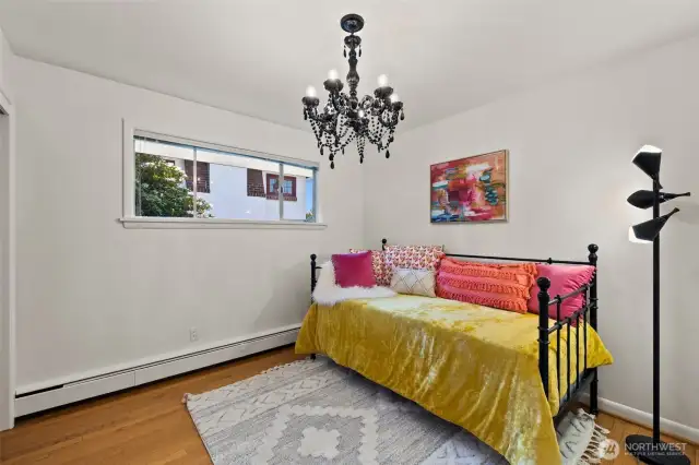 Bedroom 2 upstairs with fresh paint and hardwood floors.