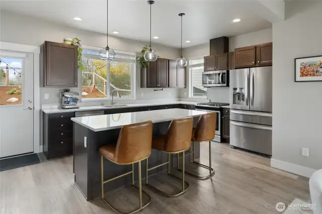 Hand blown glass pendant lights. All great room light fixtures are from Room & Board.