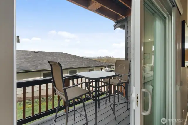 Side deck off the dining area provides seamless dining inside and out.