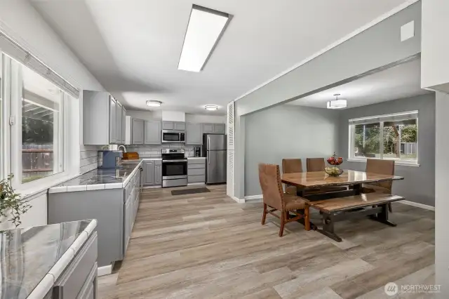 Large dining room off of kitchen, which leads to the living room, keeps you in touch with everyone in the house.