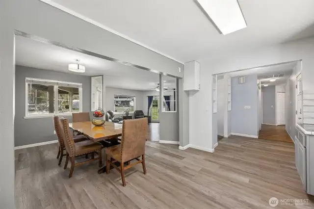 Dining room with fresh paint and stair step down into sunken living room.