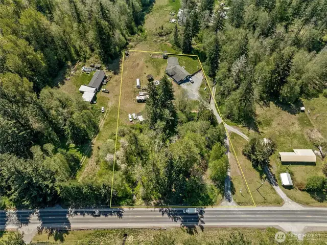 2.16 acres includes the start of a large pole barn and various outbuildings.