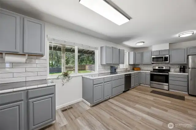 Kitchen offers plenty of space for additional bistro seating.