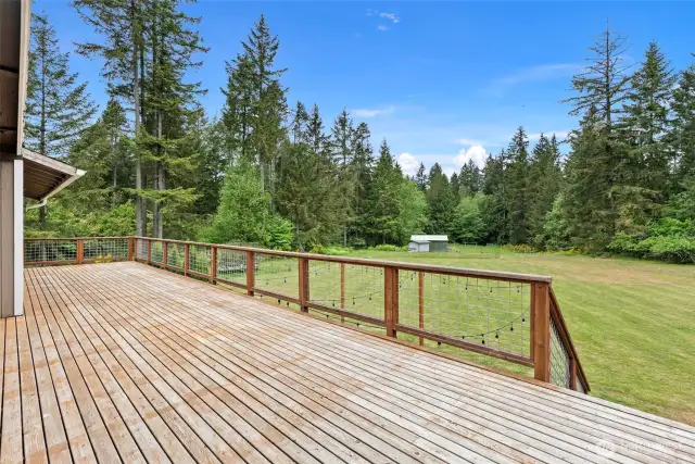 The deck was recently rebuilt and enjoys wide stairs down to the lower level patio and yard.