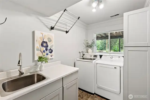 The utility room has great storage.  There is plumbing to put a toilet back into this area, if desired.