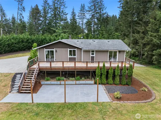 The back of the home is so welcoming and perfect for large gatherings with the huge deck and large patio.
