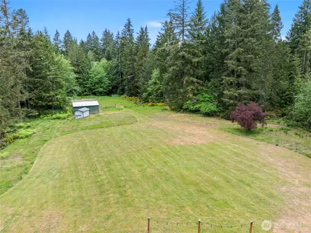 Aerial view of the acreage and the outbuildings on it.