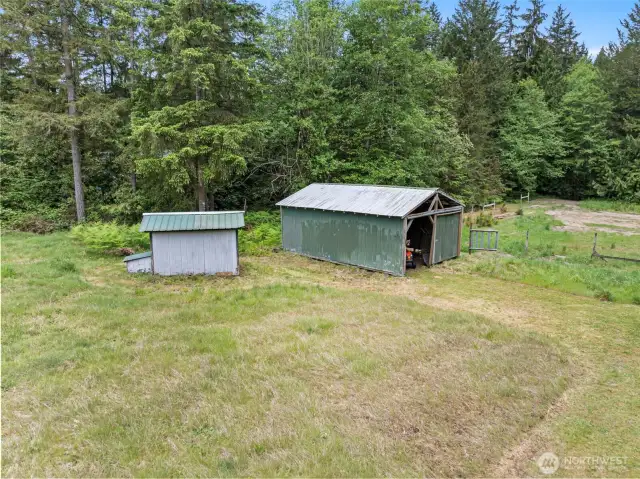 The outbuildings on the property: one is great for machinery storage (or could be used as a 1-horse paddock), the other building is the well house.