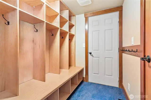 The garage entry with storage cubbies for shoes, coats and backpacks