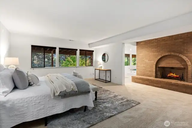 Luxe primary on lower level with fireplace and 5 piece bath