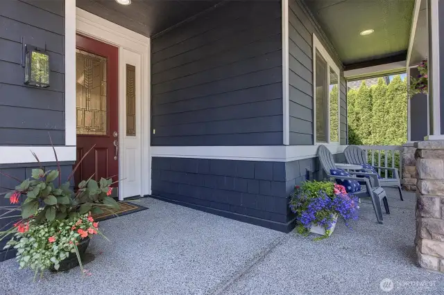 Covered front porch. New front yard sod.