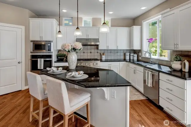 Chef kitchen with walk in pantry and newer SS appliances.