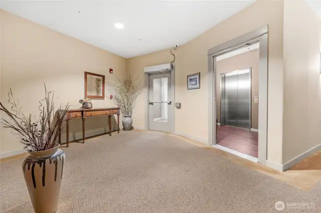 Lobby and elevator. The elevator services all floors including the secured lower garage.