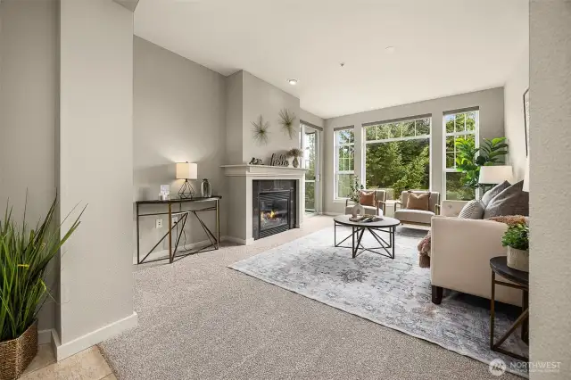 Spacious living room complete with gas fireplace and access to your private deck.