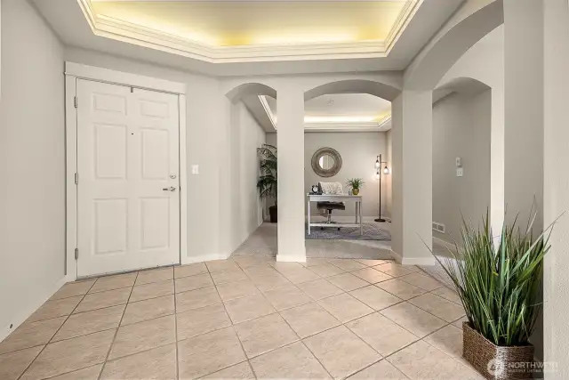 Condo entrance and versatile bonus room. Currently utilized as a home office. Could easily be a formal dining room, playroom, etc.