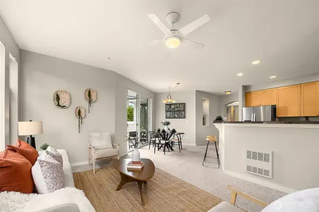 Open concept family room, kitchen and dining room. Doors lead to your private balcony.