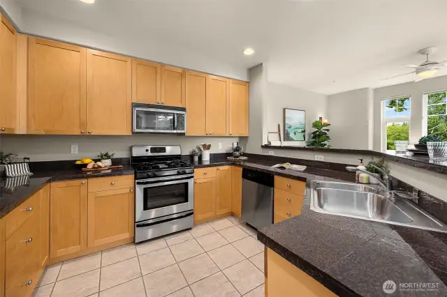 Entertain with this roomy kitchen. Complete with a gas stove, granite countertops, and stainless steel appliances.