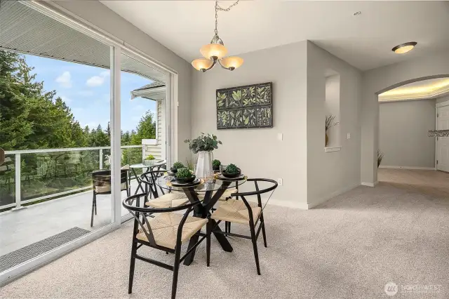 Dining room with a slider door to the balcony.