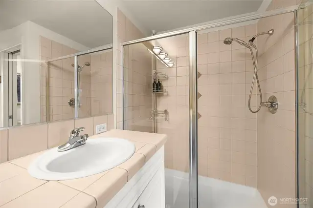 Ensuite complete with soaking tub, two vanities and separate shower.