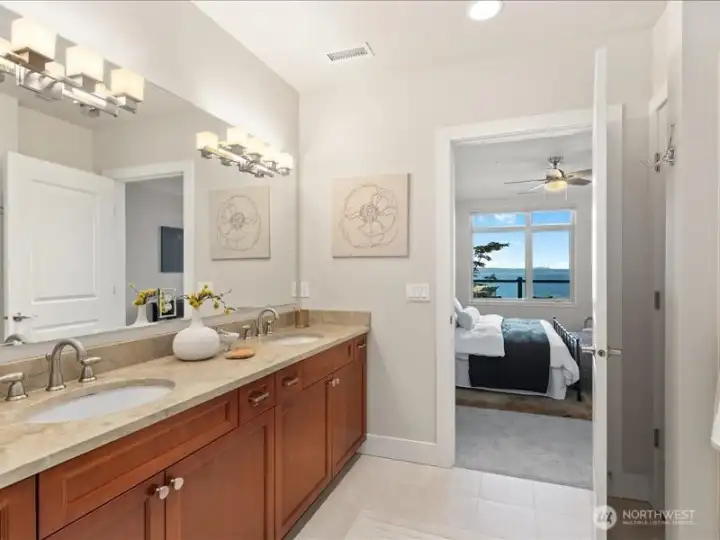 Ensuite 3/4 bath features dual sink vanity,