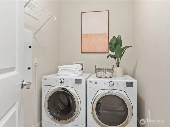 Separate laundry offers space for utility storage