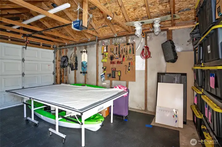 Inside of 1 car garage with ample space for car and tools