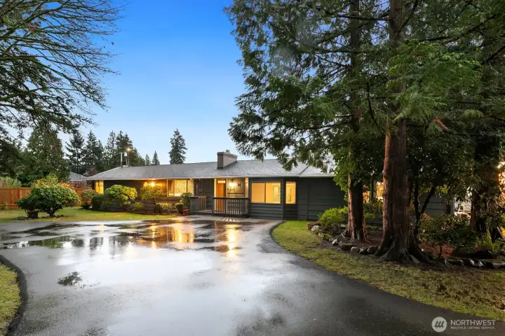 Paved circular driveway is convenient with plenty of off-street parking and room for an RV.