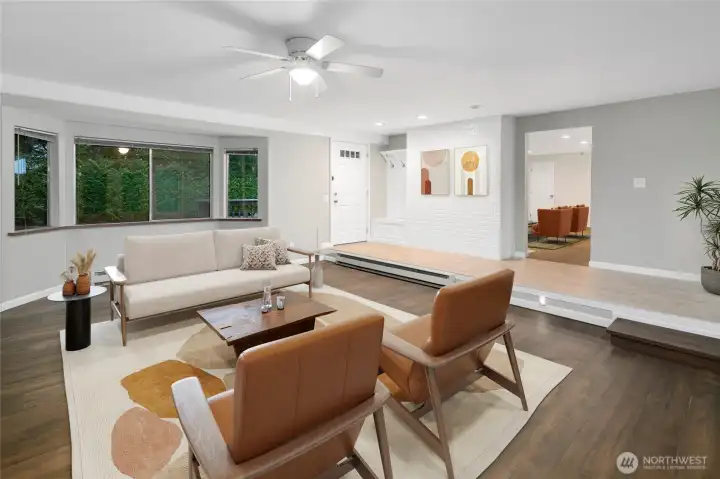 Living room with large windows virtually staged.