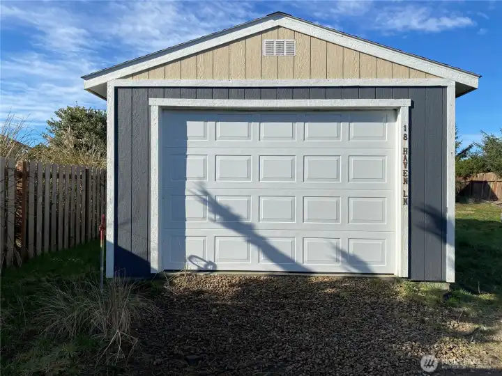 Garage with water spigot nearby