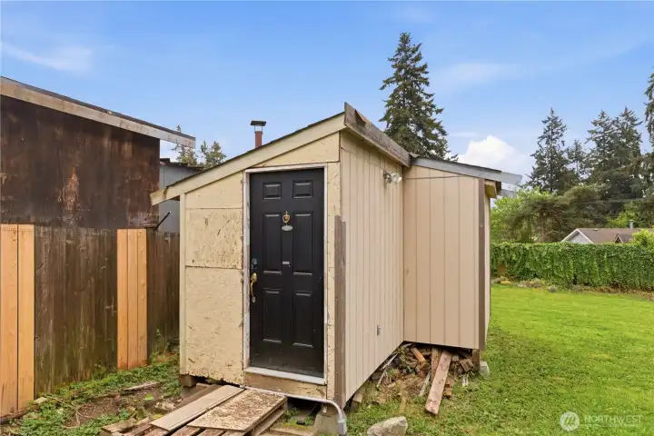 Insulated shed complete with power and a peekaboo view of the lake