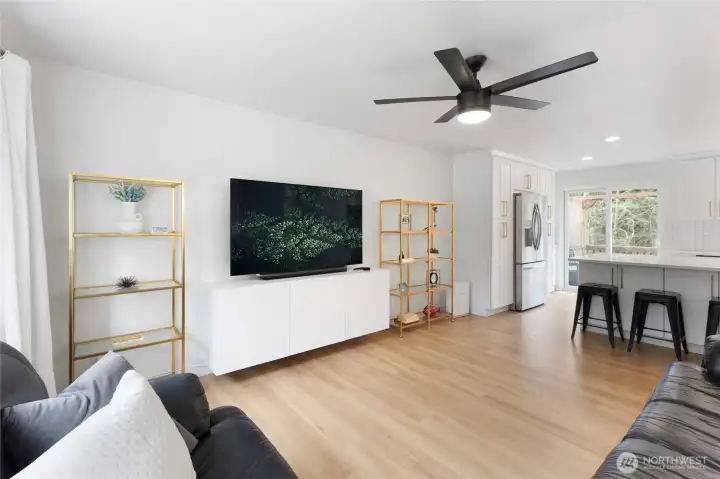 Open-concept main living area that flows seamlessly into the kitchen.
