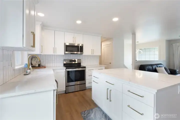 Modern lighting and clean lines enhance the home’s fully remodeled appeal.