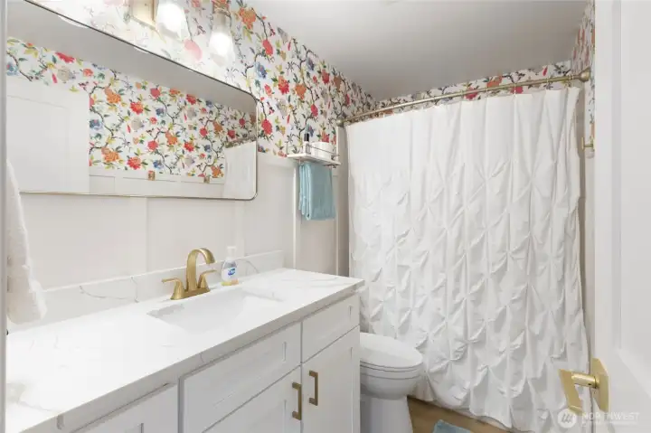 Updated full bathroom on the second floor featuring modern finishes, stylish vanity, and a clean, refreshed design.