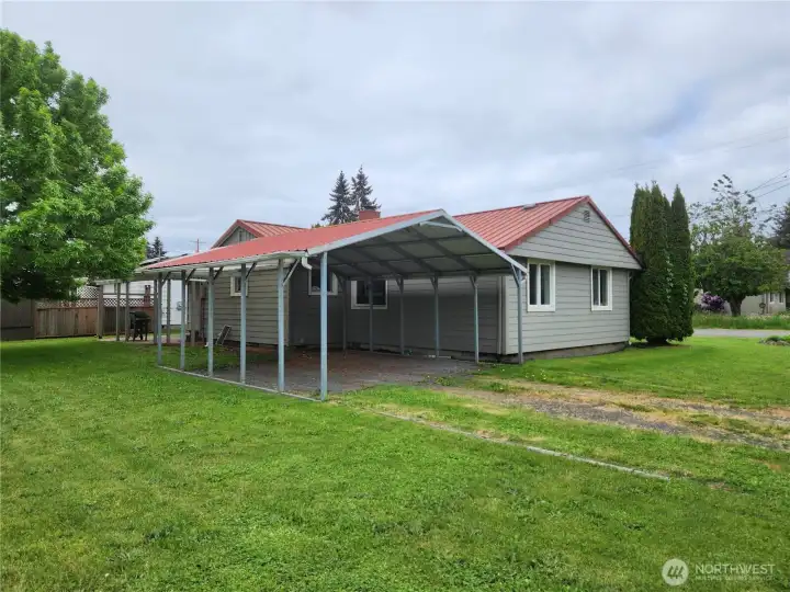 Off the back side is another driveway leading to the carport