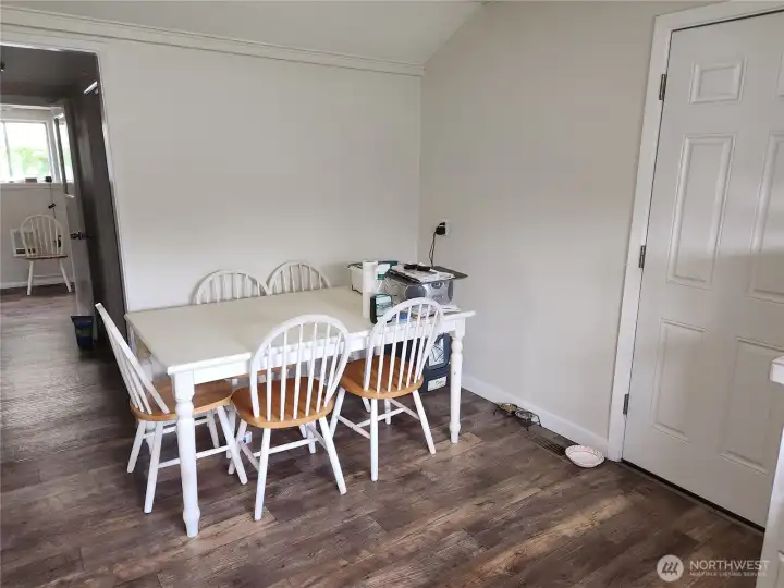Plenty of space for a good sized table. Left of photo leads to full size bathroom and utility room.