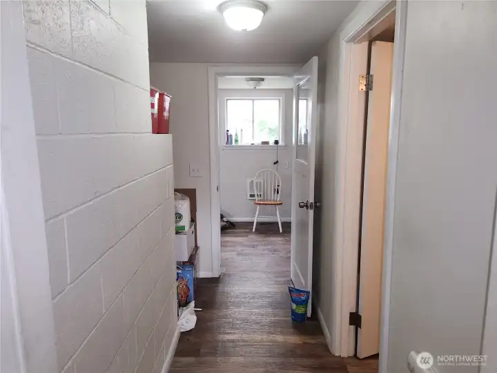 Hallway, bathroom to the right and utility room at the end of hallway.