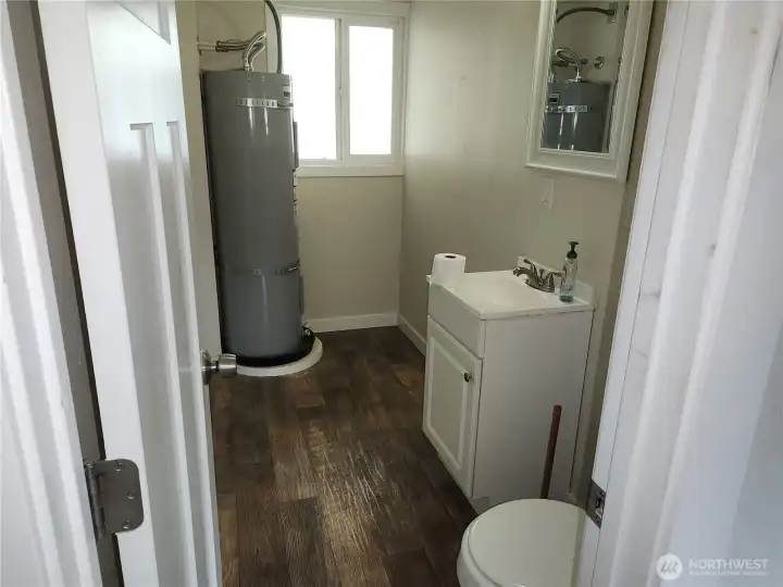Half bathroom, water heater off the garage