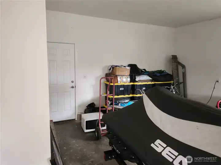 Another view of the garage, door leads to back porch