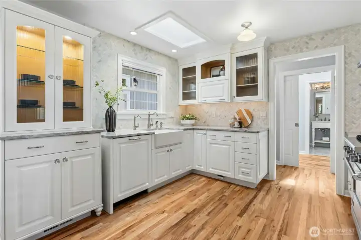 Beautiful finish details including cabinet lighting, hardware and walk-in pantry.