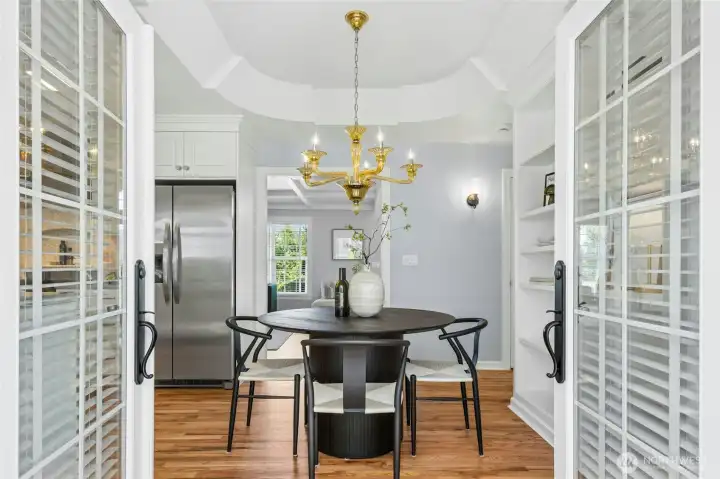 French doors that lead to the fenced patio between the house and the detached shop/garage.
